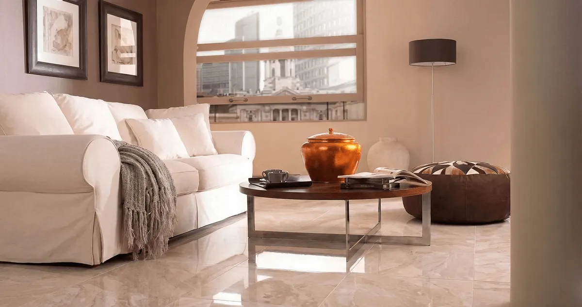 Modern living room with professionally installed marble flooring, a beige sofa, coffee table in Nashville, TN